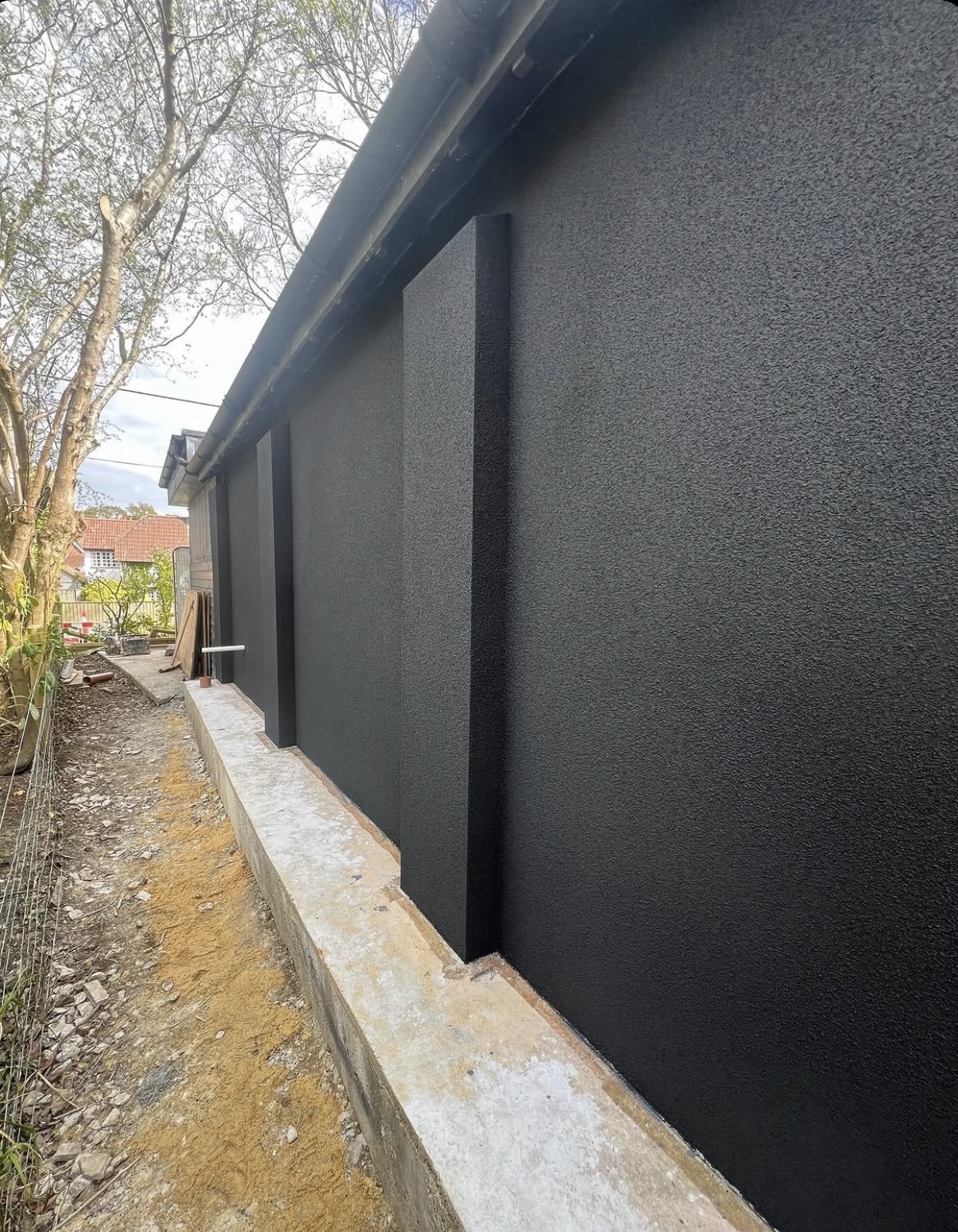 Black K Rend silicone TC15 thin coat render finish on an external building elevation